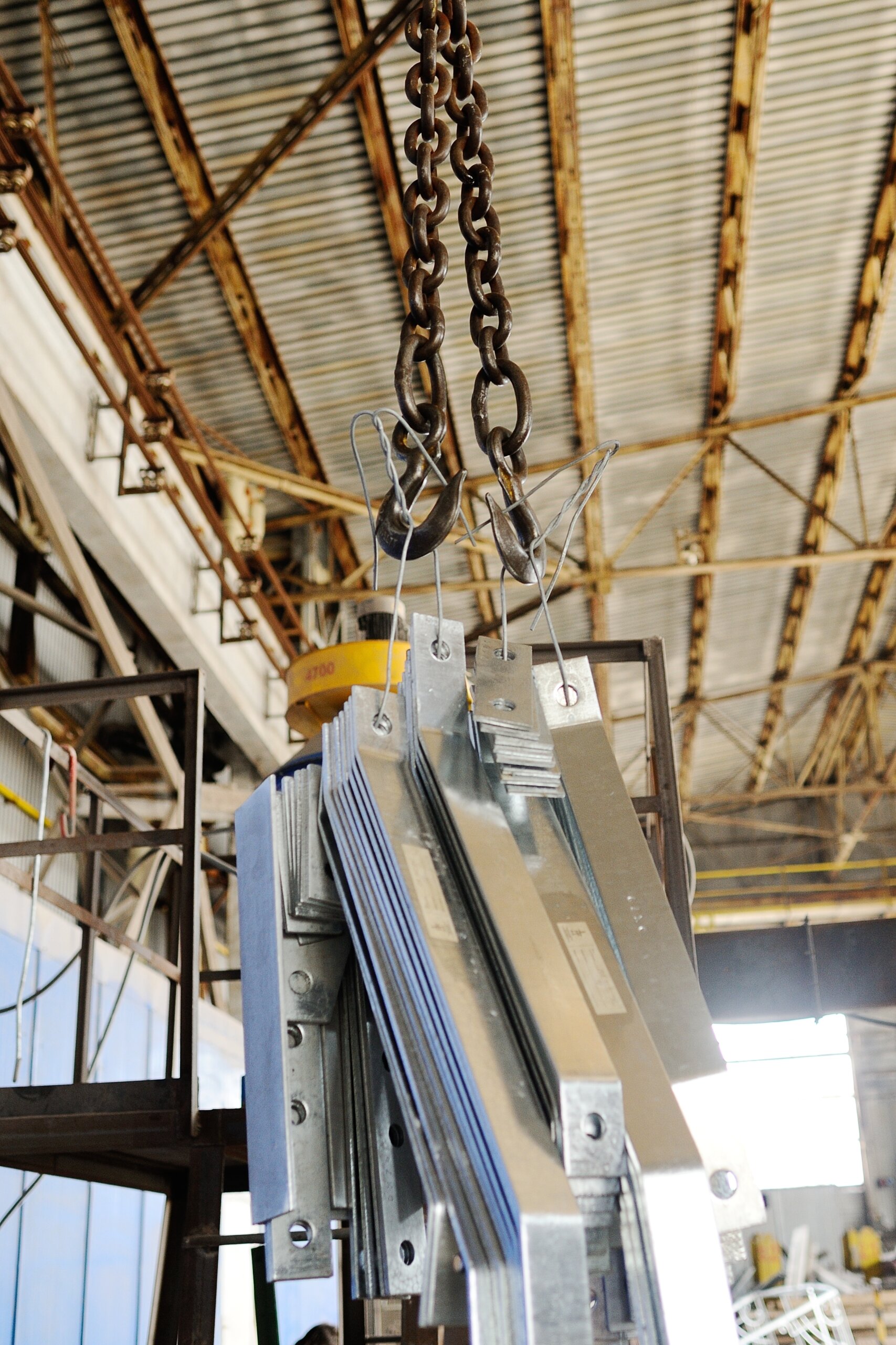 Crane,Hook,Lifts,Cargo,On,Production,Background